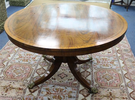 A Regency rosewood circular breakfast table banded with satinwood